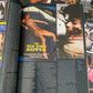 Book or magazine with text and images on a collage of movie posters.